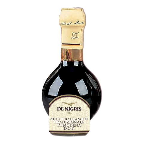 Bottle of De Nigris balsamic vinegar on a white background