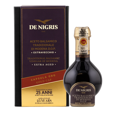 De Nigris balsamic vinegar bottle and box on a white background