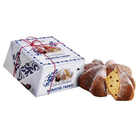 Baked good with decorative box on a white background