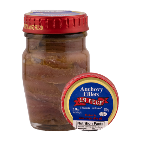 Jar of anchovy fillets with a red lid and La Fede label on a white background