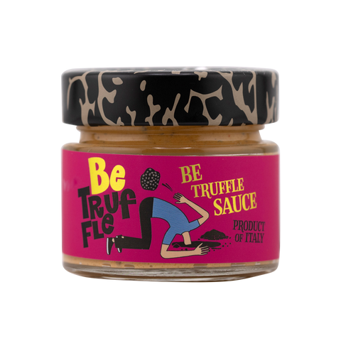 Jar of Be Truffle Sauce with pink label and black lid on white background