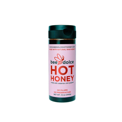 Bottle of bee dolce hot honey on a white background