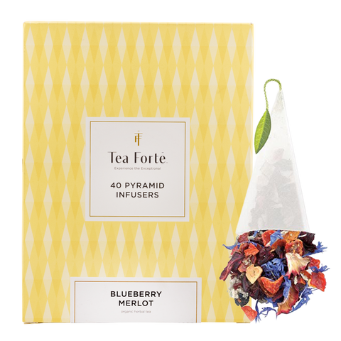 Tea Forte pyramid infusers packaging with a sample of colorful tea leaves on a white background