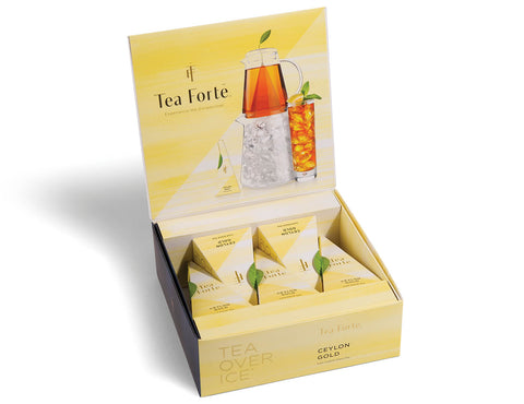 Tea Forte tea box display with yellow packaging and tea bags.