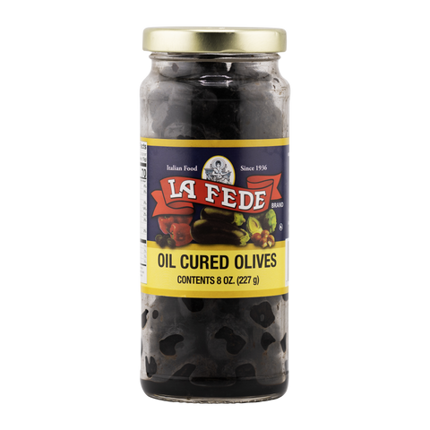 Jar of oil cured olives with La Fede label on a white background