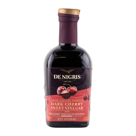 Bottle of De Nigris Dark Cherry Sweet Vinegar on a white background