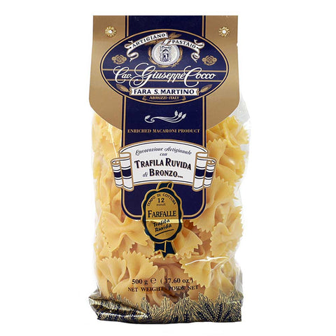 Bag of pasta with a blue and gold label on a white background