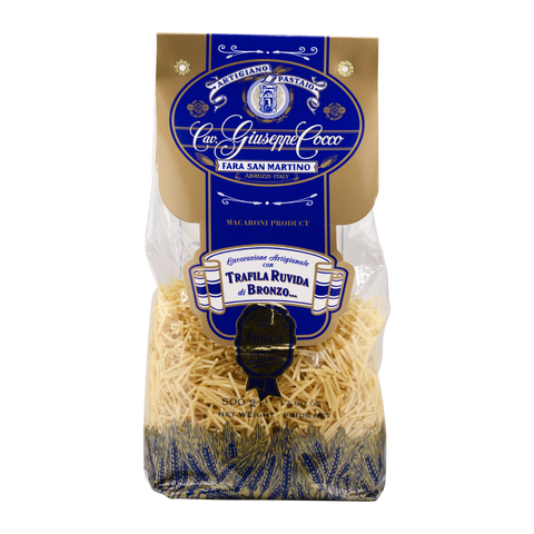 Bag of pasta with a blue and gold label on a white background