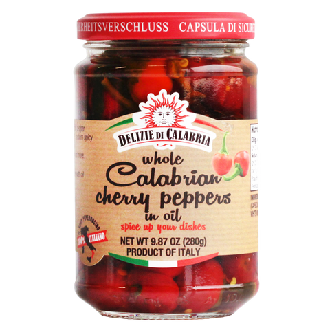 Jar of Delizie di Calabria whole Calabrian cherry peppers in oil on a white background