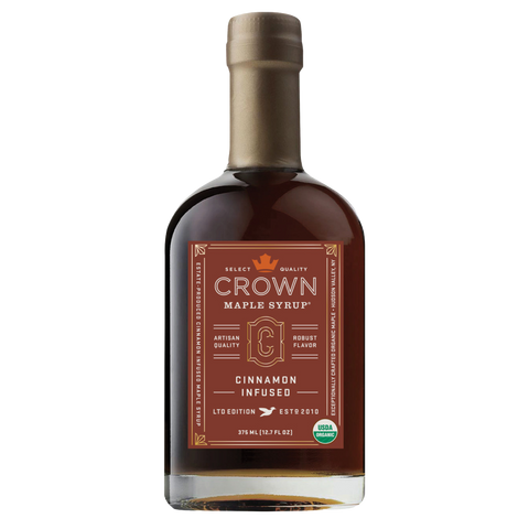 Bottle of Crown Maple Syrup with cinnamon infusion on a white background