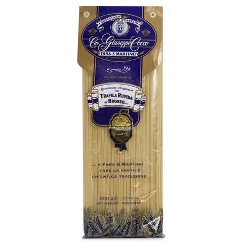 Pasta package with blue and gold label on a white background