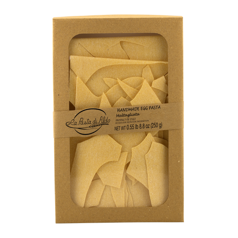 Box of handmade egg pasta with a clear window showing the pasta inside, on a white background.