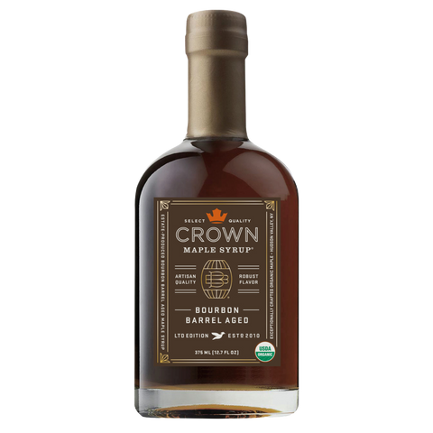 Bottle of Crown Maple Syrup with a label on a white background
