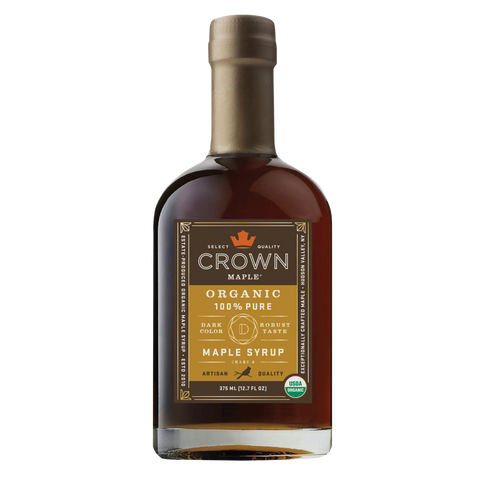 Bottle of Crown Maple Organic 100% Pure Maple Syrup on a white background
