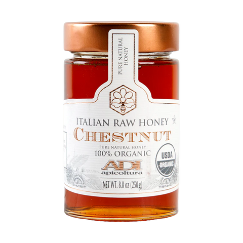 Jar of Italian raw chestnut honey with a white label on a white background