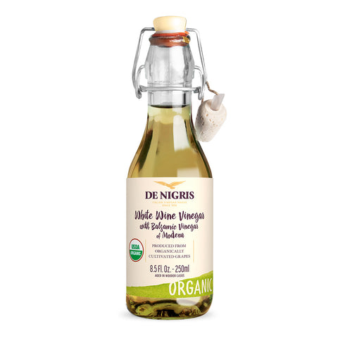 Bottle of De Nigris White Wine Vinegar with Balsamic Vinegar of Modena on a white background