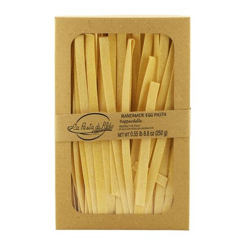 Pappardelle pasta in a brown cardboard box with 'La Pasta di aldo' branding.
