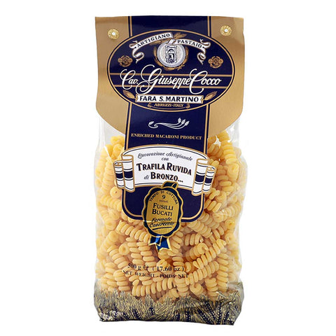 Bag of Giuseppe Cocco pasta with blue and gold label on a white background