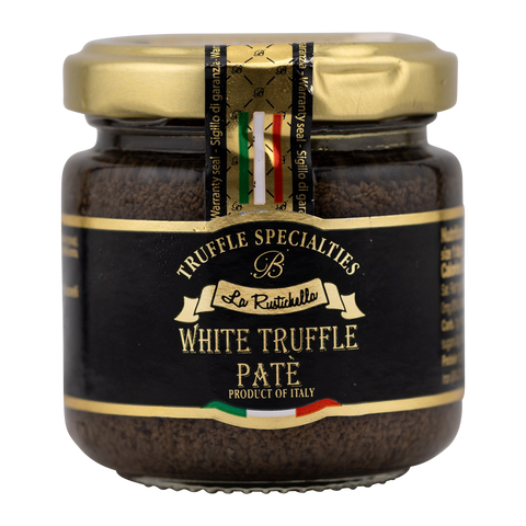 Jar of white truffle pate with gold lid on a white background